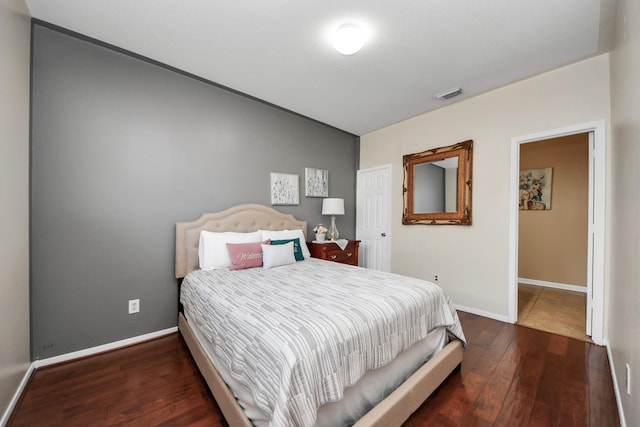 bedroom featuring dark hardwood / wood-style floors