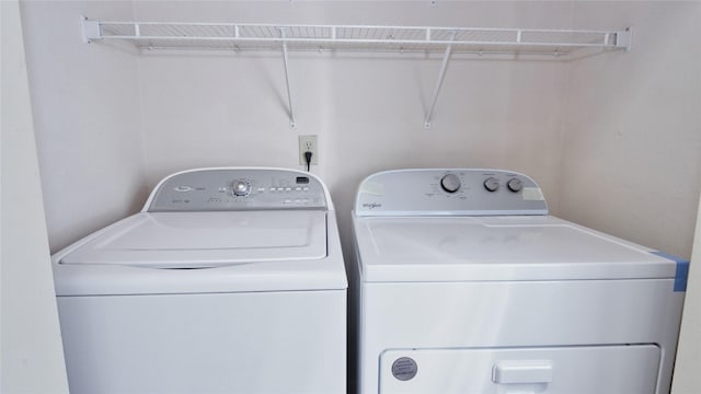 laundry area featuring washing machine and clothes dryer