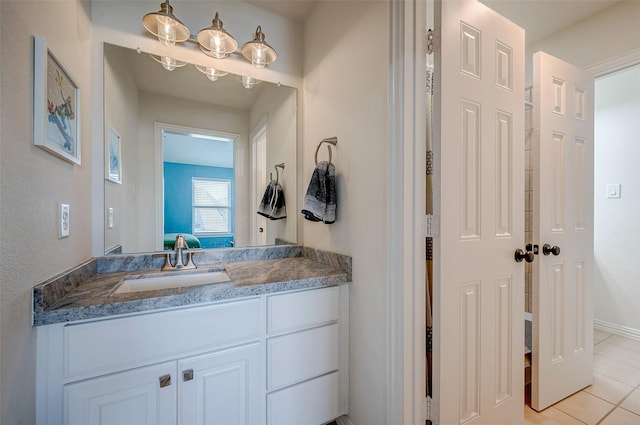 bathroom with vanity and tile patterned flooring