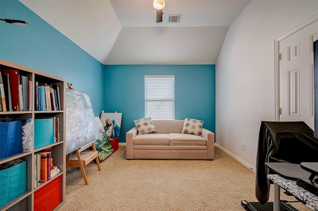 sitting room with carpet flooring and lofted ceiling