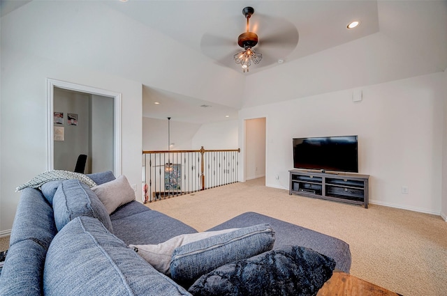 carpeted living room featuring ceiling fan