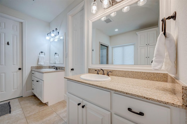 bathroom featuring vanity and tile patterned flooring