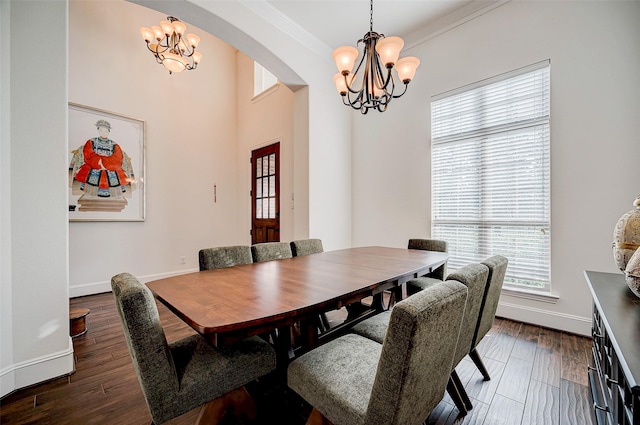 dining room with a chandelier, dark hardwood / wood-style floors, and crown molding