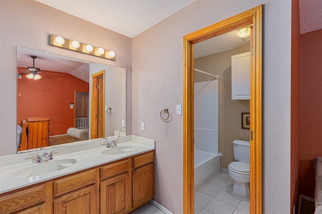 full bathroom with toilet, a textured ceiling, vanity, ceiling fan, and tile patterned flooring