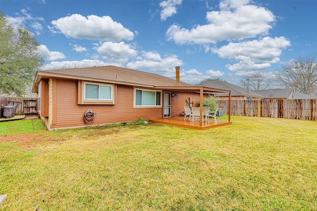 back of house with a lawn