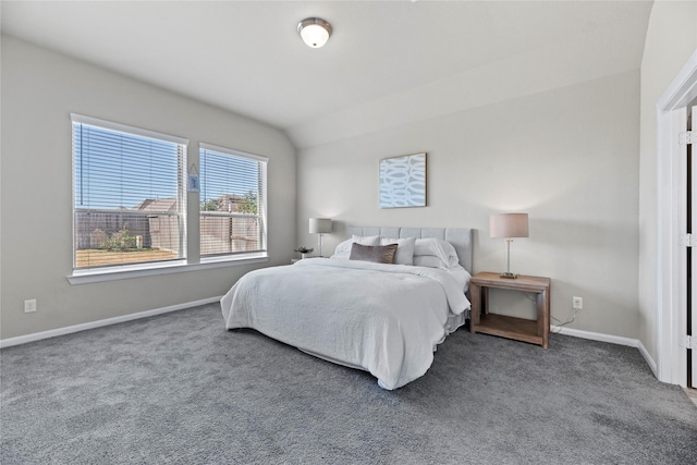 carpeted bedroom featuring lofted ceiling