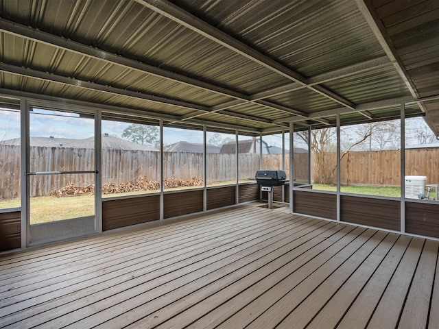 unfurnished sunroom featuring a mountain view