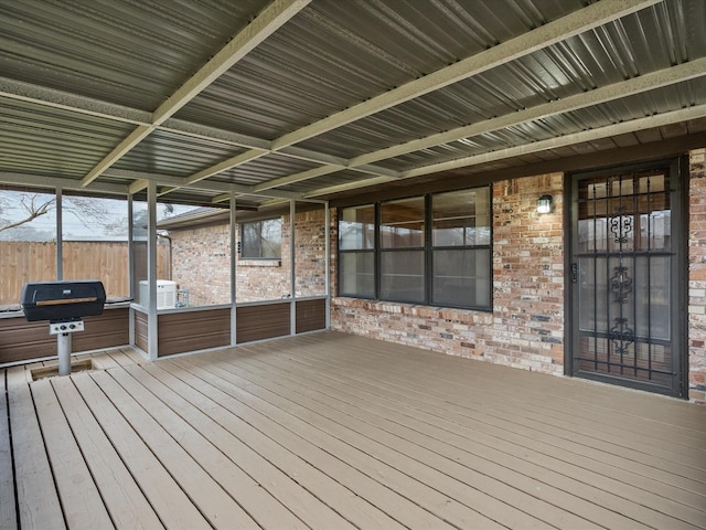 wooden terrace with a grill