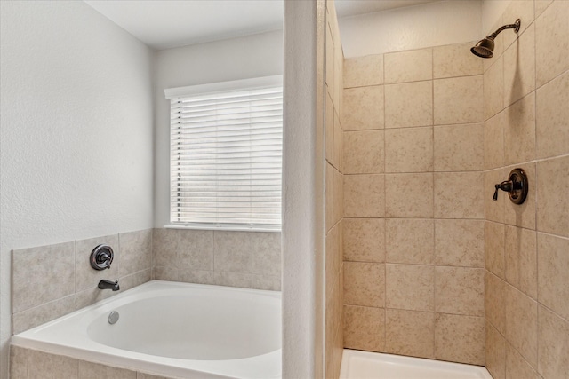 bathroom featuring independent shower and bath