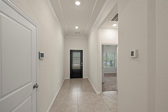 interior space featuring light tile patterned floors and ornamental molding