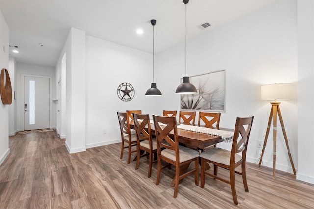 dining room with hardwood / wood-style flooring