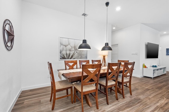 dining space featuring dark hardwood / wood-style floors