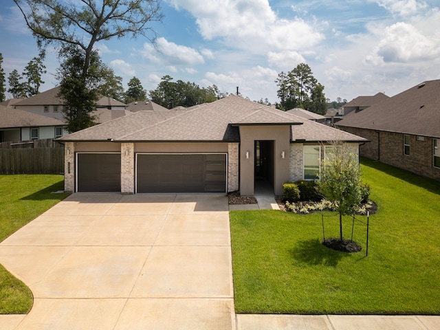 view of front facade with a garage and a front yard