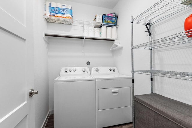 clothes washing area featuring washing machine and clothes dryer