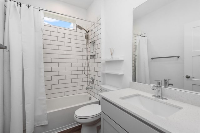 full bathroom featuring vanity, toilet, and shower / tub combo