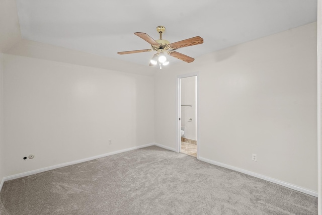 empty room with ceiling fan and light colored carpet