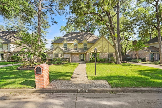 tudor-style house with a front lawn