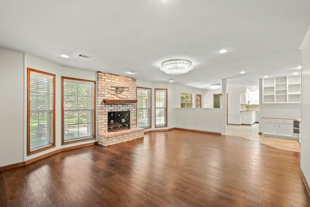 unfurnished living room with a fireplace and light hardwood / wood-style flooring