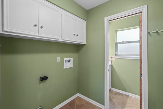 laundry area featuring light tile patterned flooring, cabinets, hookup for an electric dryer, and hookup for a washing machine