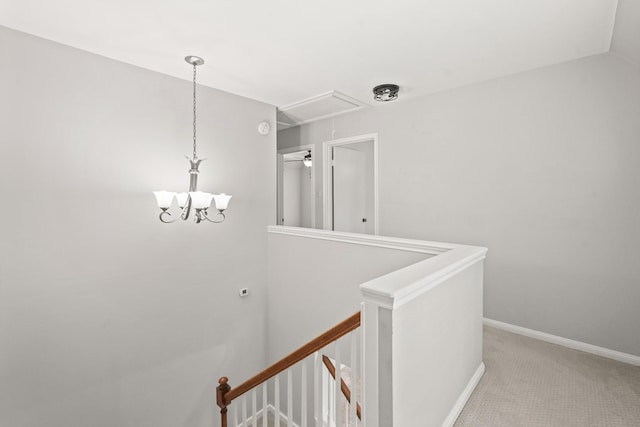 hallway with carpet and lofted ceiling