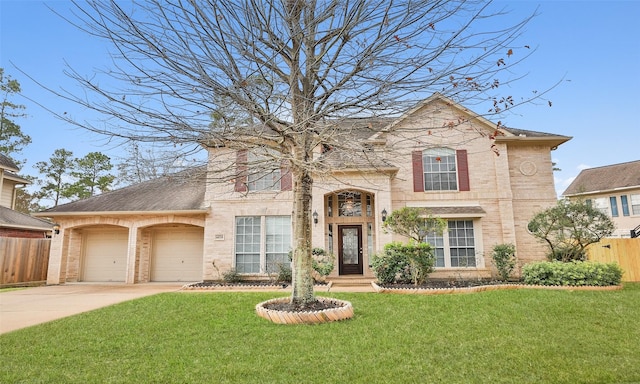 view of front facade with a garage and a front lawn