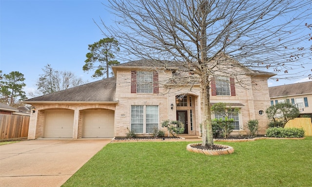 view of front of home featuring a garage and a front lawn