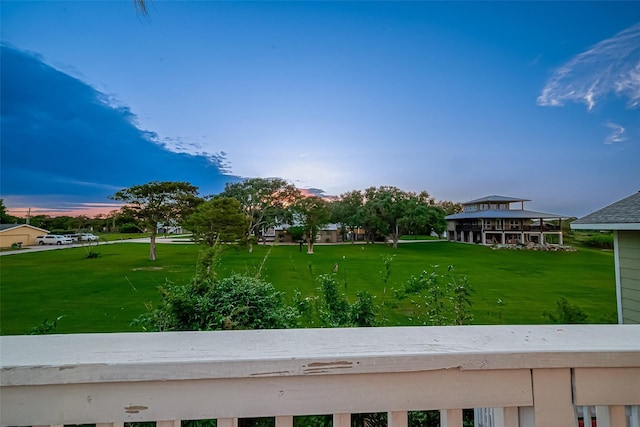 view of yard at dusk