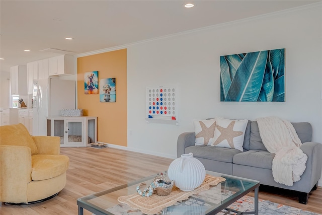 living room with hardwood / wood-style floors and crown molding