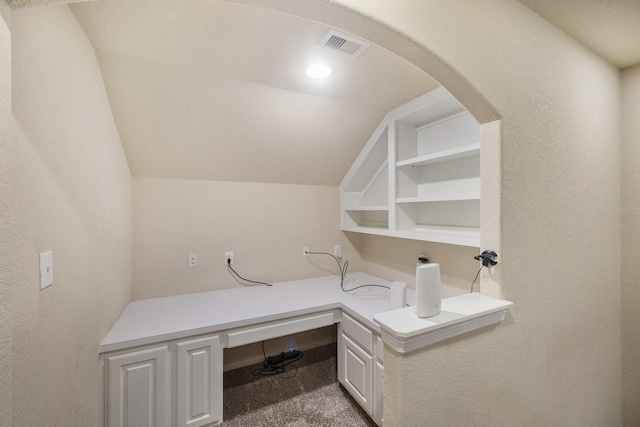 office area featuring lofted ceiling and carpet flooring