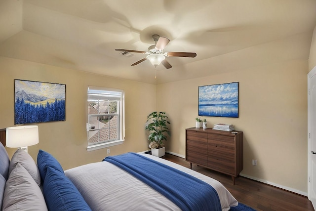 bedroom featuring ceiling fan and dark hardwood / wood-style floors