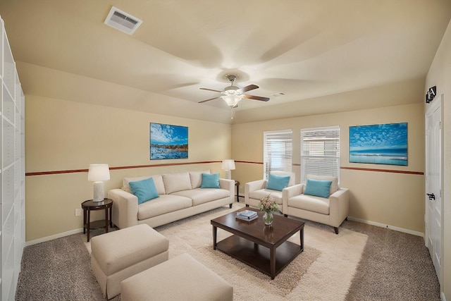 living room featuring light colored carpet and ceiling fan