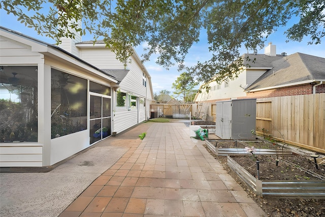 view of patio with a sunroom