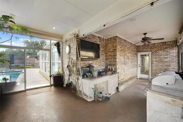 view of patio featuring ceiling fan, a fenced in pool, and area for grilling