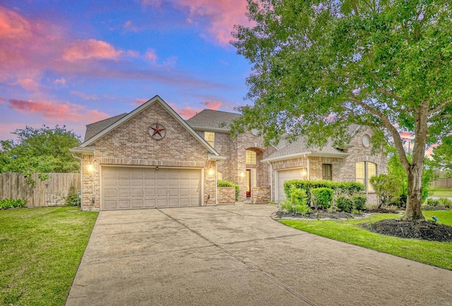 4715 Cedarfield Rd, Katy, TX 77494 - view of front of home with an attached garage, concrete driveway, brick siding, and roof with shingles