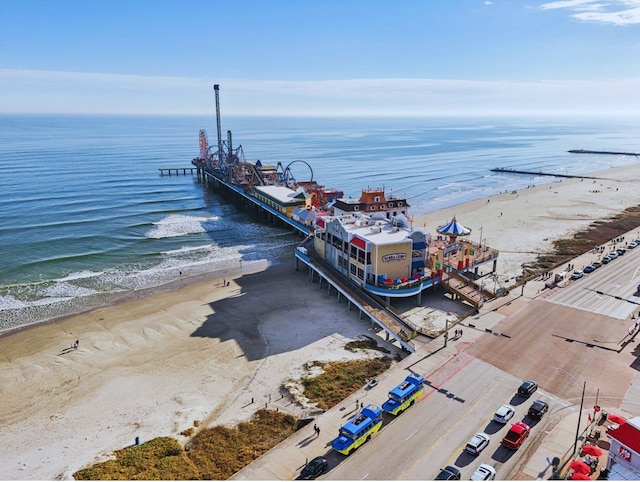 birds eye view of property with a view of the beach and a water view