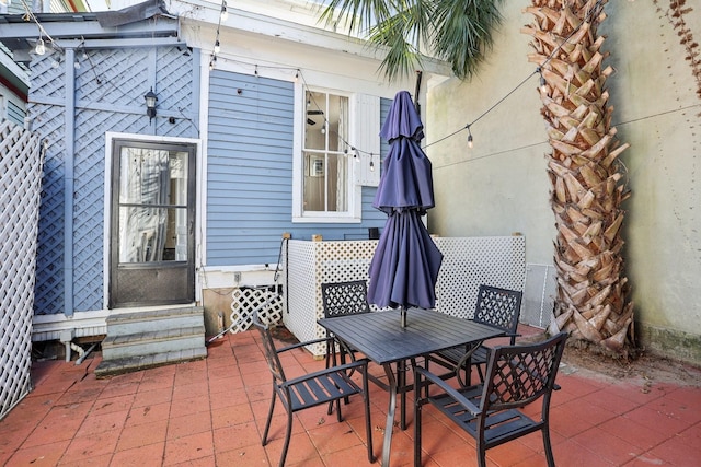 view of patio featuring entry steps and outdoor dining area