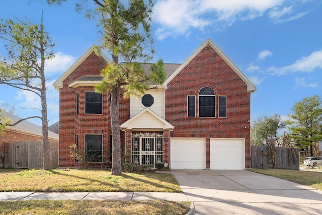 view of front property featuring a garage and a front lawn