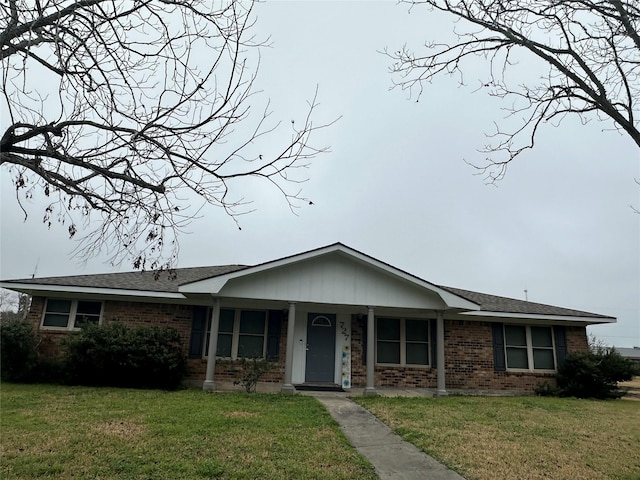 single story home featuring a front lawn