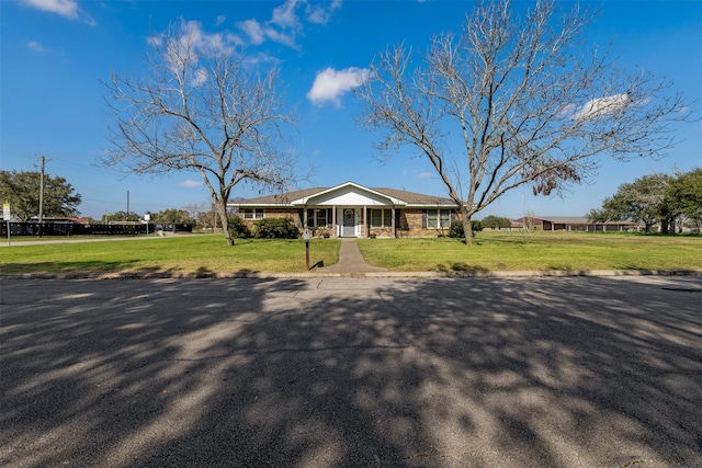 ranch-style house with a front lawn