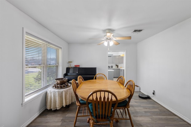 dining area featuring dark hardwood / wood-style floors and ceiling fan