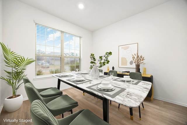 dining area with wood-type flooring