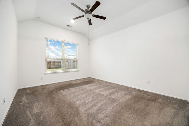 carpeted empty room featuring lofted ceiling and ceiling fan