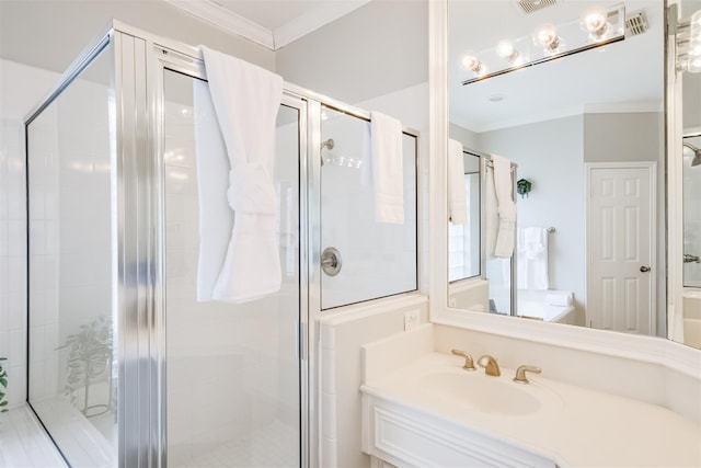 full bath featuring visible vents, ornamental molding, a shower stall, and vanity