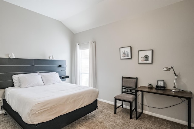 carpeted bedroom featuring vaulted ceiling and baseboards