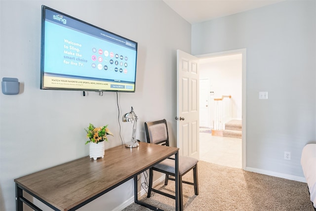 home office featuring light carpet and baseboards