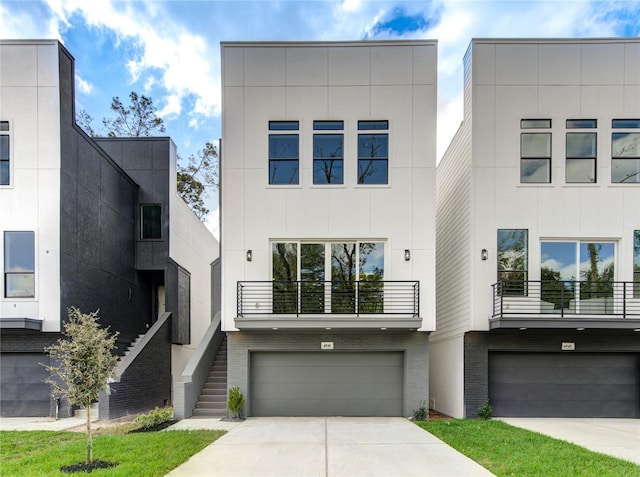 contemporary home featuring a balcony and a garage