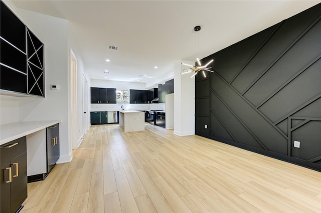 unfurnished living room featuring light wood-type flooring