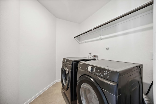 laundry room with washer and clothes dryer