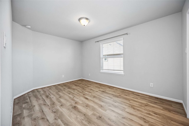 spare room featuring light hardwood / wood-style floors