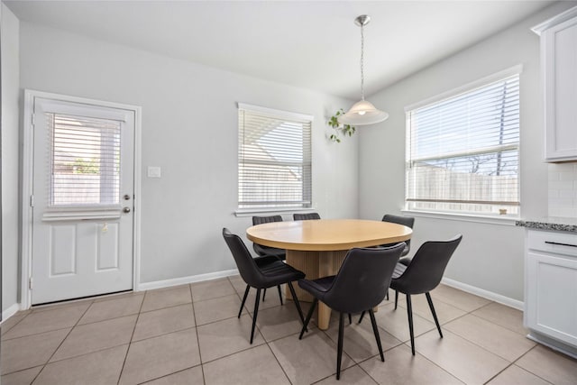 dining space with light tile patterned floors